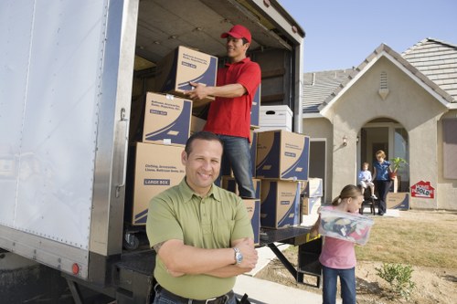 Packing and loading items into a moving truck in Knightsbridge