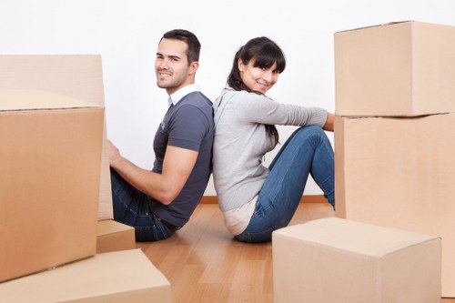 Careful loading of valuable belongings into a moving van in Knightsbridge